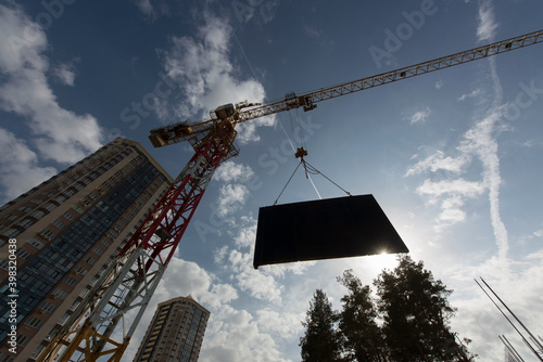 Tower crane. Construction site. Production of apartments, social housing.