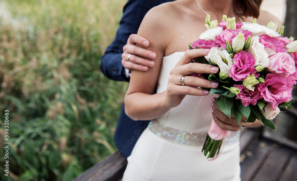 bride holding wedding bouquet ,
hands of a young woman with wedding rings bride holding wedding bouquet ,
hands of a young woman with wedding rings