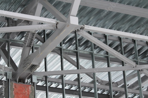 An old steel metal farm. structure of metal structure of frame-type industrial building. Lightweight metal frame construction.