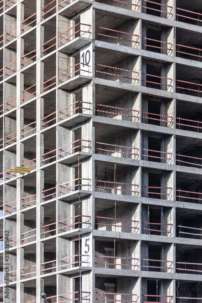 Modern new multi-storey building under construction in the city Modern new multi-storey building under construction in the city