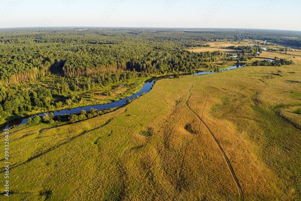 Aerial view of winding river and forest. Summer landscape, top view.