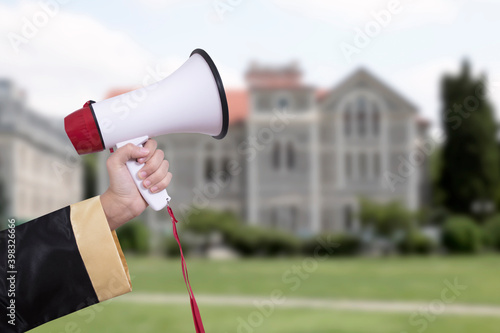 student shouting through megaphone