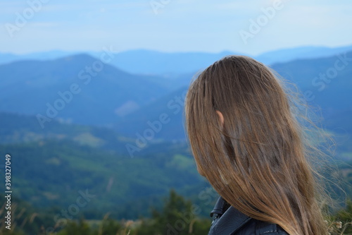 girl admires the mountain view © Ihar