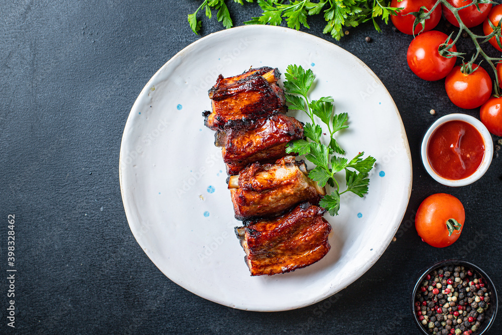 ribs grilled BBQ spices tomato sauce piece of meat second course snack ready to eat on the table meal snack top view copy space for text food background rustic ribs grilled BBQ spices tomato sauce piece of meat second course snack ready to eat on the table meal snack top view copy space for text food background rustic