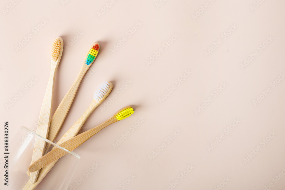 Fototapeta premium bamboo toothbrushes on a beige background