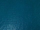 Sea surface aerial view, top down landscape of ocean water from drone.