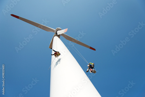 Fotografia repair work on the blades of a windmill for electric power production - copy spa
