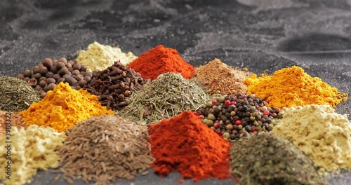 Different spices on dark background