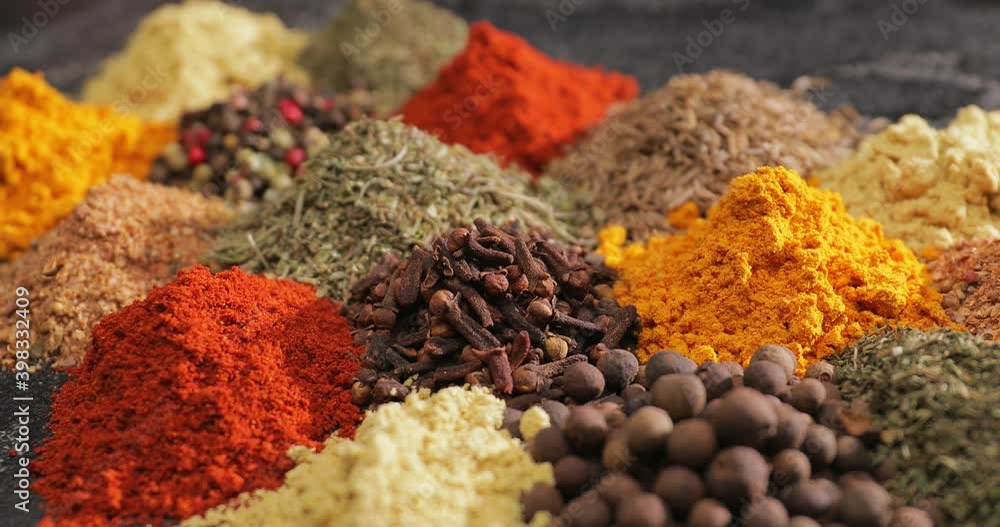 Different spices on dark background, closeup Different spices on dark background, closeup