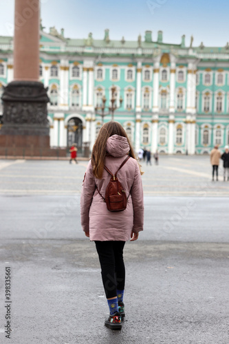 young teen girl walking in the center of St. Petersburg, Russia © Olga