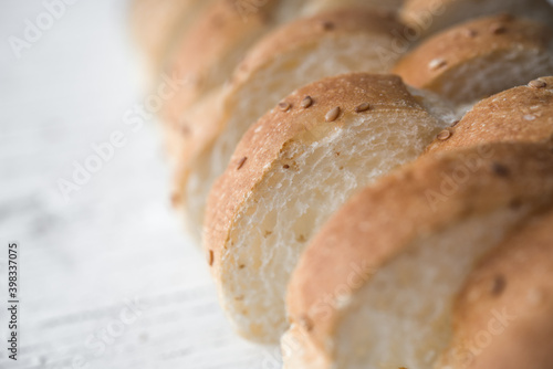 Fresh bread sliced baguette in white background