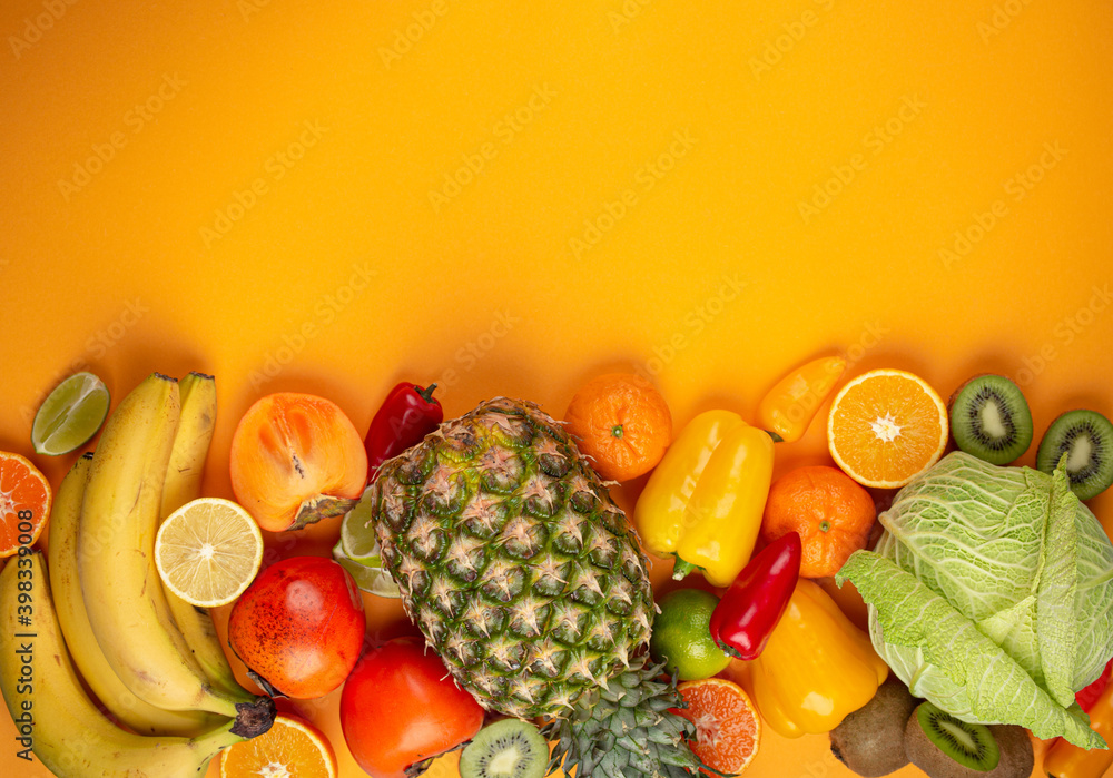 Fruit, citrus, vegetables with vitamin C, yellow background top view