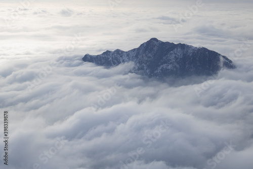 Above the clouds. Scenic view of the mountain named "Barro" emerging from the clouds in Lombardy, Italy © davidepalli