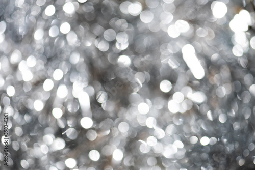 Trendy gray color of the 2021 year. Grey abstract sparkle bokeh ultimate background
