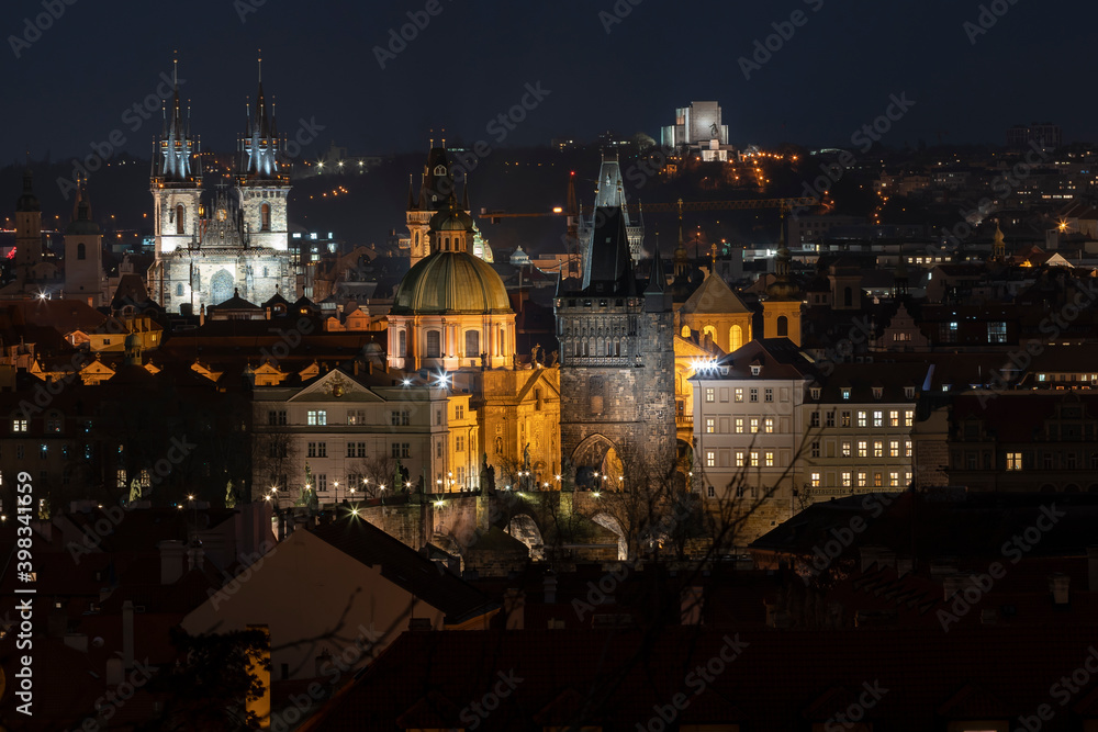 .light from street lights and a view of the city of Prague