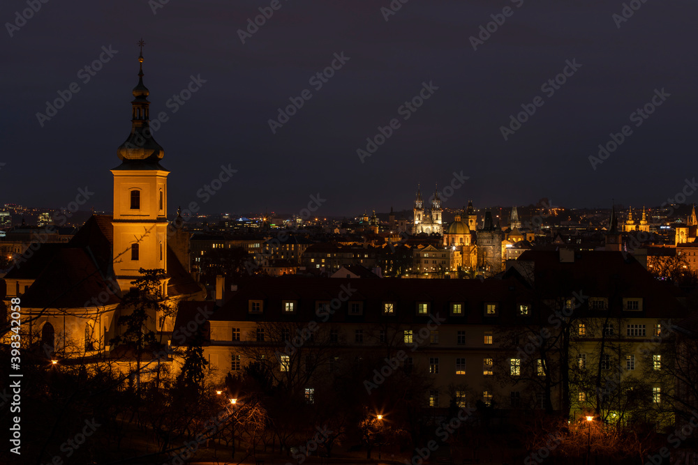 .light from street lights and a view of the city of Prague