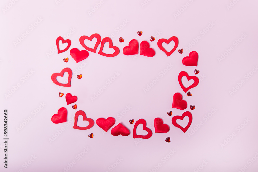 Rectangle frame made of various types of hearts on the pink background, Valentines day greeting card. Love concept. Copy sapce.