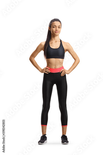 Full length portrait of slim young woman in sportswear