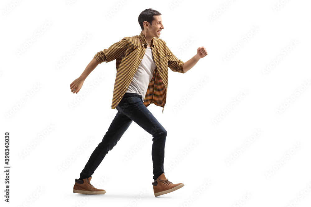 Full length profile shot of a casual man in jeans and shirt running Full length profile shot of a casual man in jeans and shirt running