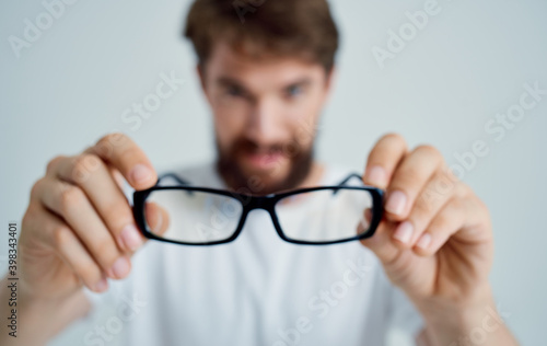 bearded man wearing glasses poor eyesight health problems treatment Studio