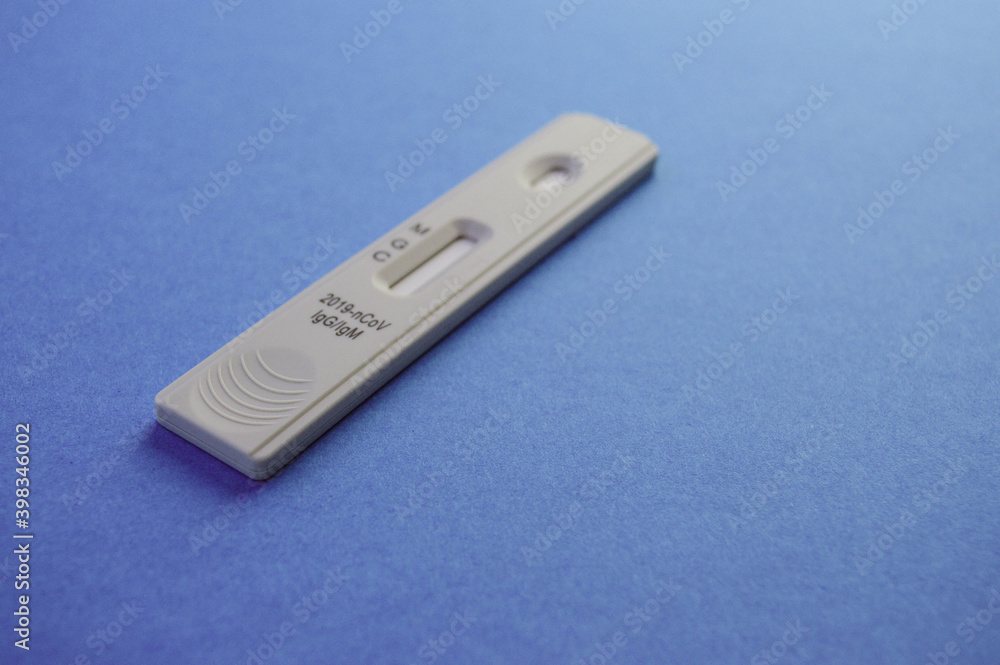 Rapid Covid-19 coronavirus strip test cassette for antibody or sars-cov-2 virus disease in hands epidemic concept background close. Rapid Covid-19 coronavirus strip test cassette for antibody or sars-cov-2 virus disease in hands epidemic concept background close.