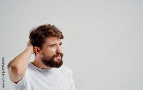 bearded man holding his head emotions lifestyle health problems dissatisfaction