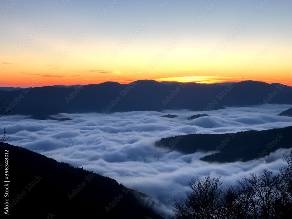 sunset and clouds in the mountains