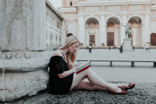 Woman Writing Outside photo