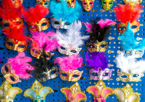 Fototapeta Naklejka Na Ścianę i Meble -  Various, colourful Venetian masks with feathers, souvenirs