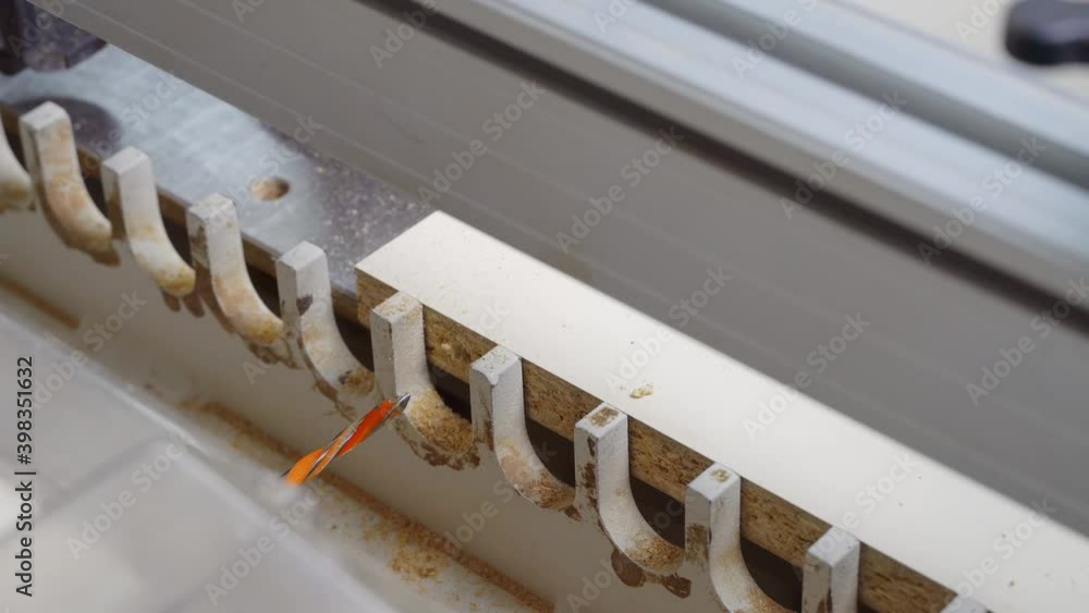 Automatic drilling machine for cutting wood. drill holes for pieces of wood. Close up. A person manages the process. Furniture production. Automatic drilling machine for cutting wood. drill holes for pieces of wood. Close up. A person manages the process. Furniture production.