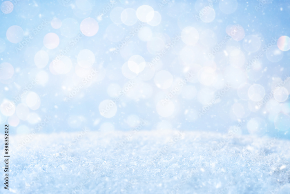 Abstract Blue Christmas Background with Snow. Blurred Snowflakes Photo.