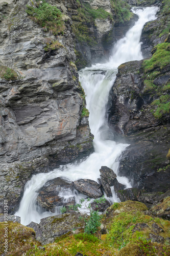 Waterfalls on the wild creek in rocky gorge  Norway