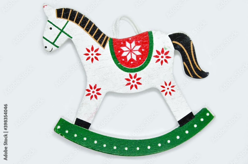 Toy rocking horse Christmas decoration. Vintage style, grey gradient on background.