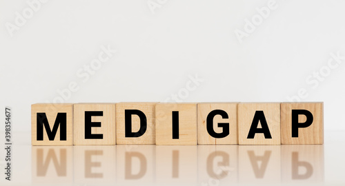 Word Medigap made with wood building blocks