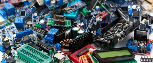 The electronic components of Arduino microcontrollers and programmers are piled up.Selective focus