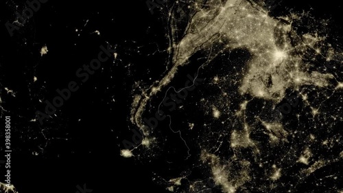 Beautiful sunrise over Earth. View from the space satellite. Cities at night. Change from Night to Day 3d Animation Rising Bright Sun. Modern business and technology concept. 4K Ultra HD.