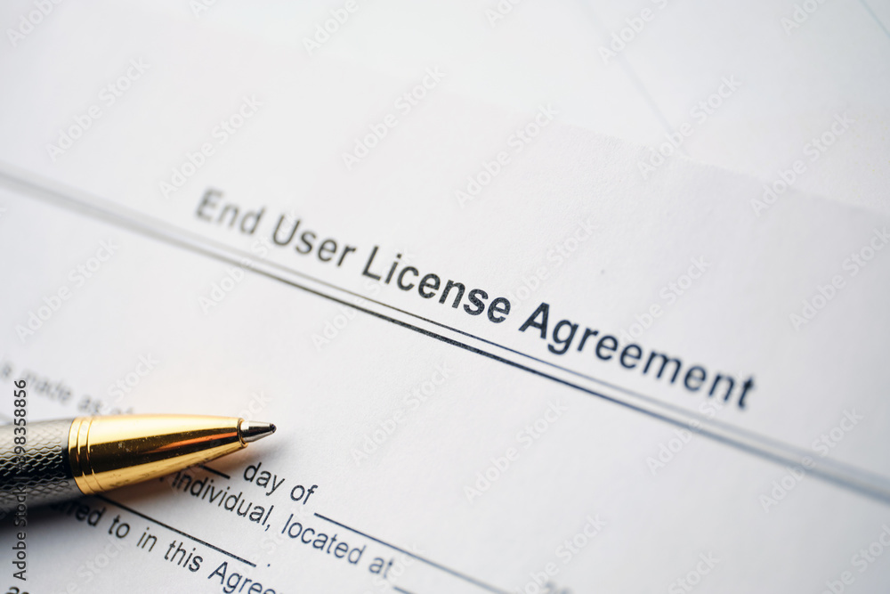 Legal document End User License Agreement on paper close up Legal document End User License Agreement on paper close up