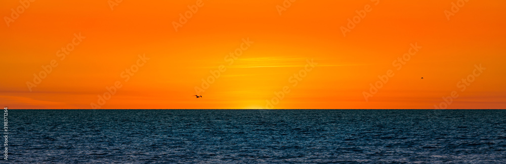 Fototapeta premium Sunset on the beach. Selective focus.