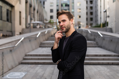 Portrait of an handsome businessman in financial district.