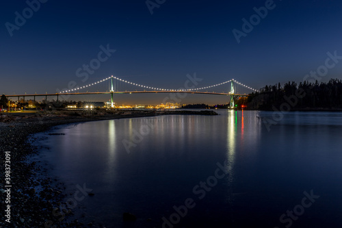 Lion's Gate Bridge at dusk or after sunset and blue hour - Vancouver, BC Canada travel and tourism