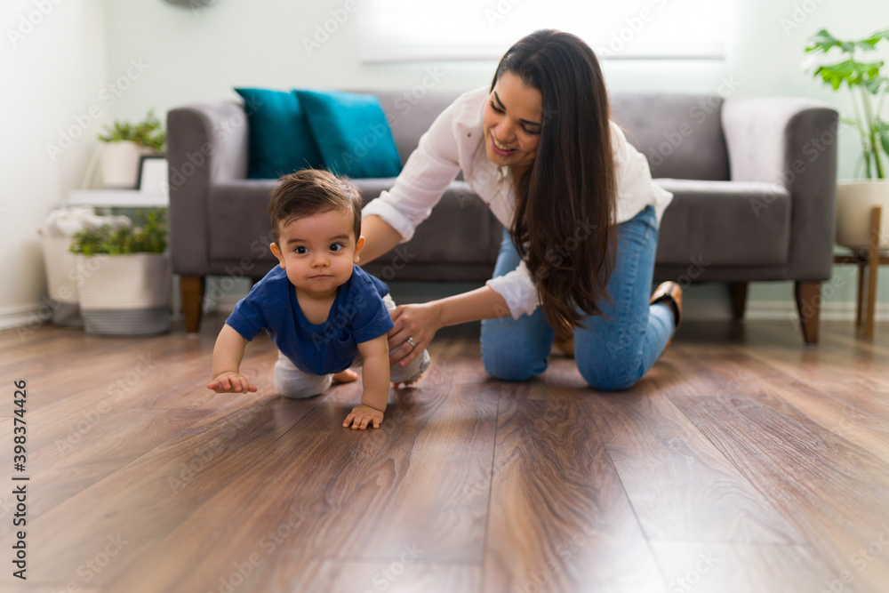 Baby learning to crawling with mother's help Baby learning to crawling with mother's help