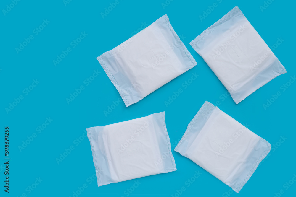 White sanitary pads on blue background. White sanitary pads on blue background.