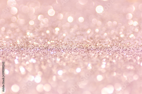 Defocused abstract pink twinkle light background. Pink glittery bright shimmering background use as a design backdrop.