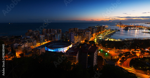 Evening view of Malaga with Port and Placa de Torros. Spain