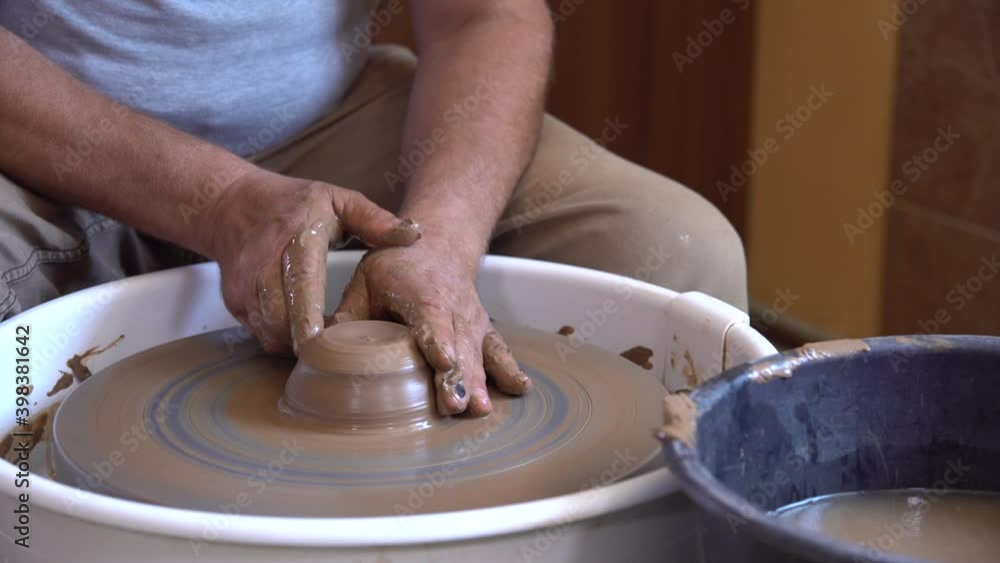 Working process of loam item in workshop. Man works in home studio. Craftsman at work. Working process of loam item in workshop. Man works in home studio. Craftsman at work.