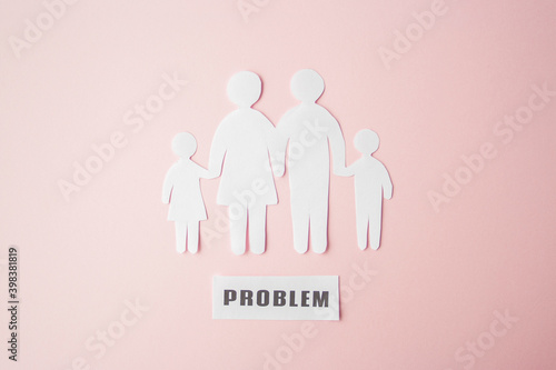 paper family cut out on bright pink background  family home  foster care  family mental health  family crisis and therapy concept. Paper family with phrase quote Problem