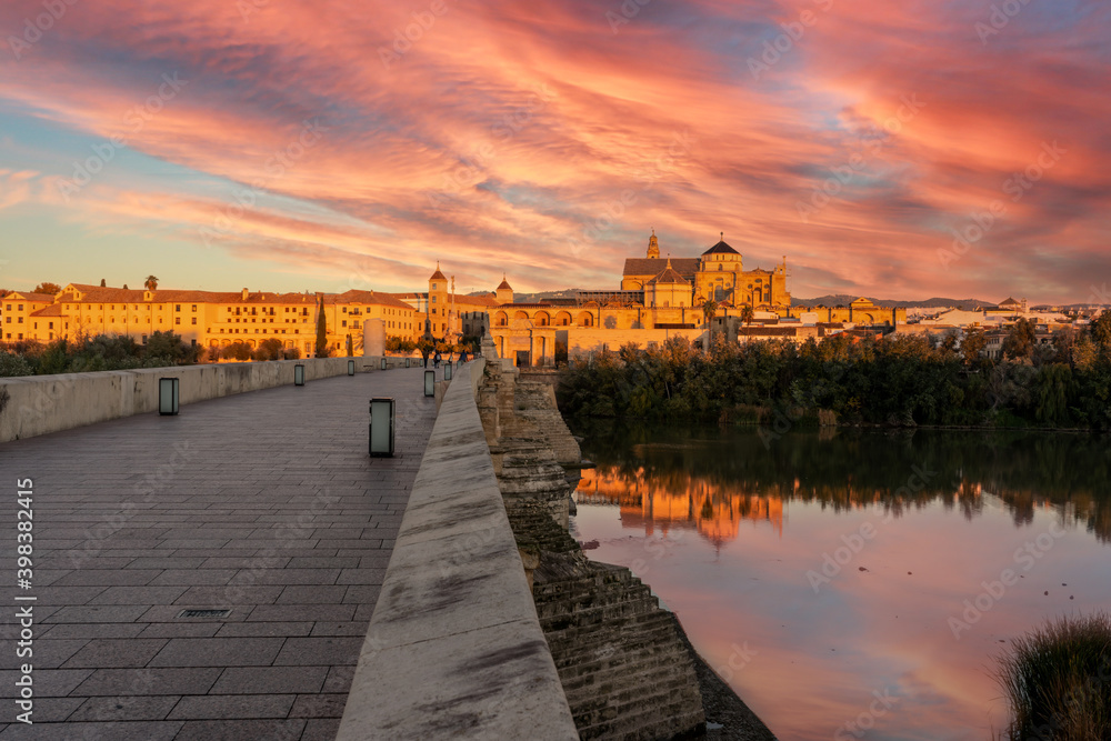 sunrise over the river in cordoba spain - cathedral of cordoba