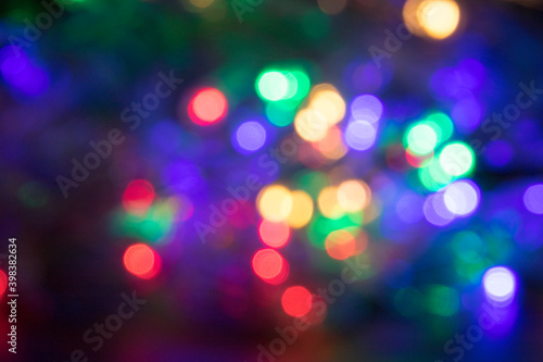 Colorful Christmas light bokeh abstract holiday background, The lights are green, yellow, gold, purple, red and blue. (for use background)