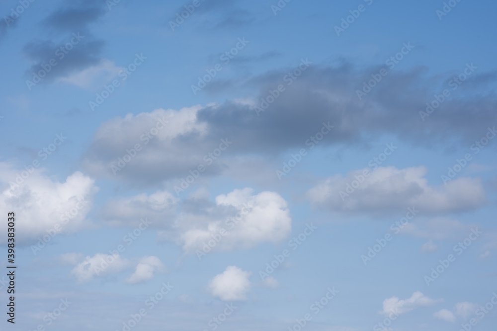 Beautiful sky background. Light blue and gray sky with a dramatic view of clouds. High quality photo