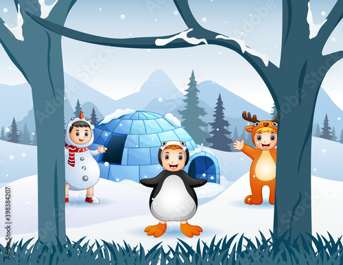 Happy kids in animal costume playing near an igloo house